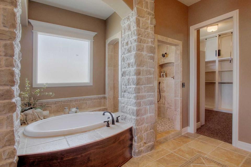 Stone spa bathroom with soaking tub